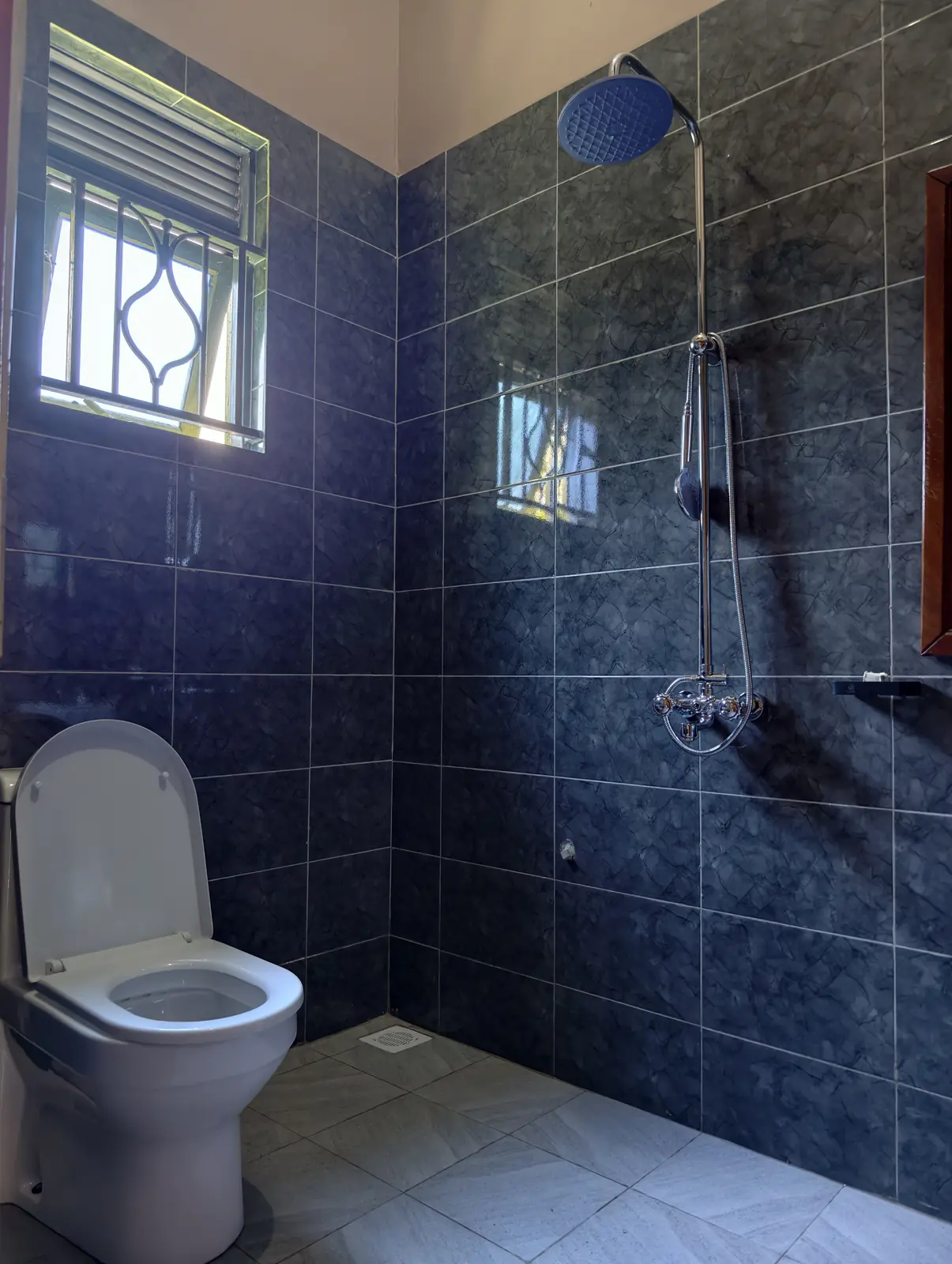 Private tiled en-suite with rainfall shower