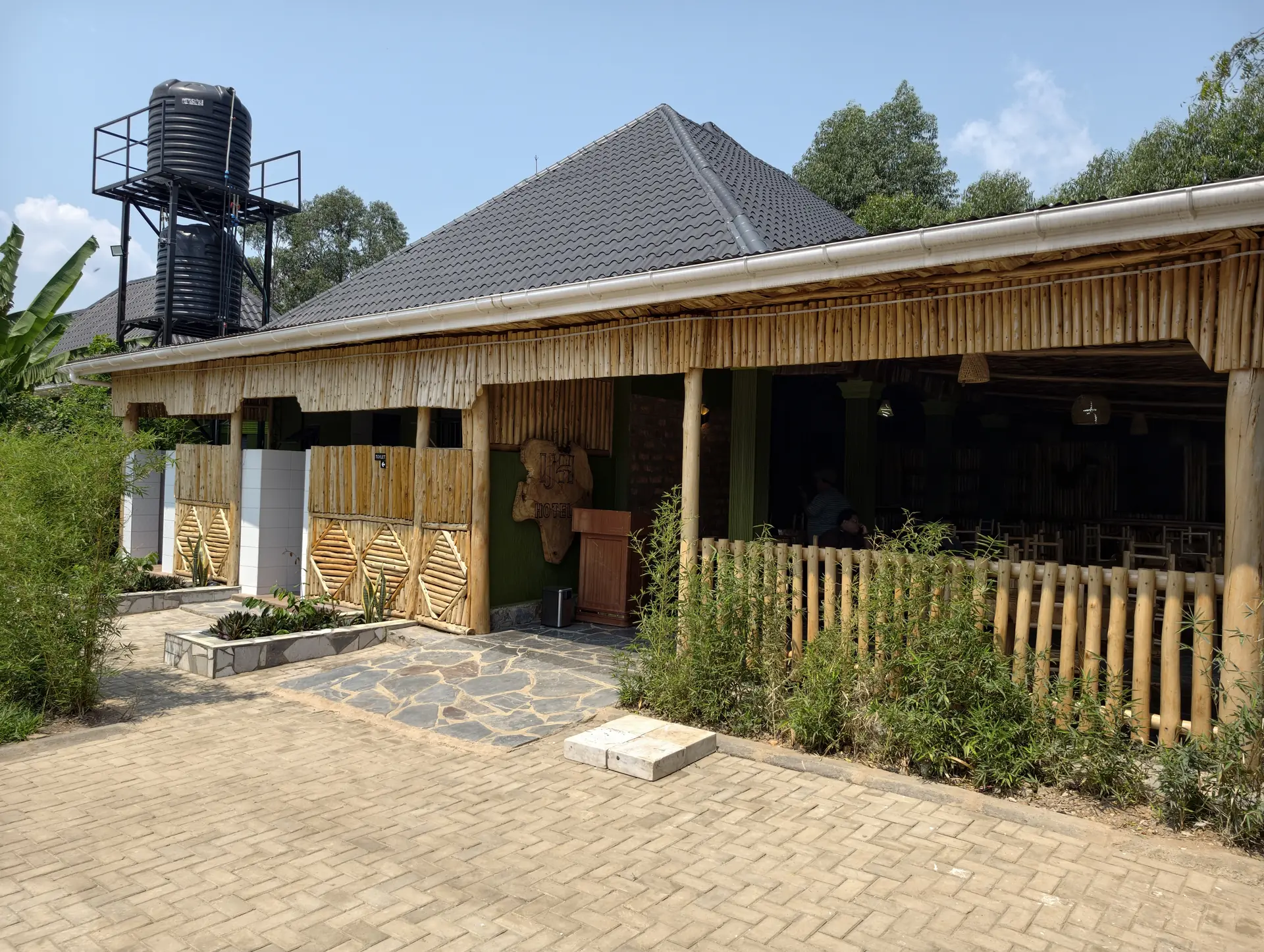 Bamboo-fronted entrance and restaurant at Ishasha Junction Hotel