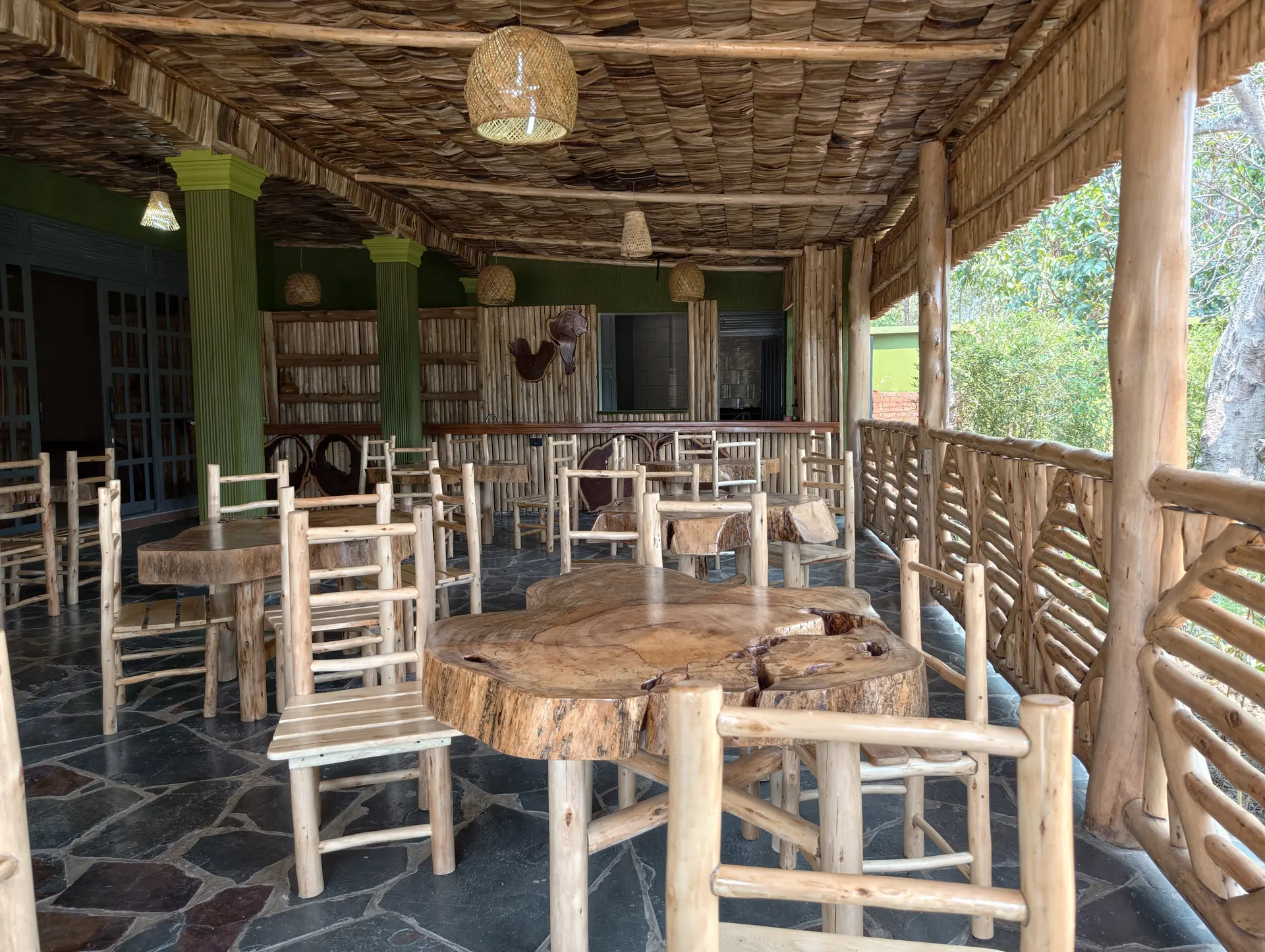 Open-air restaurant with handcrafted timber tables and bamboo seating